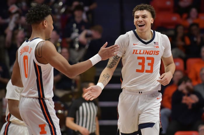 Illinois Fighting Illini forward Coleman Hawkins (33) and teammate Terrence Shannon Jr. (0) celebrate during the second half at State Farm Center.